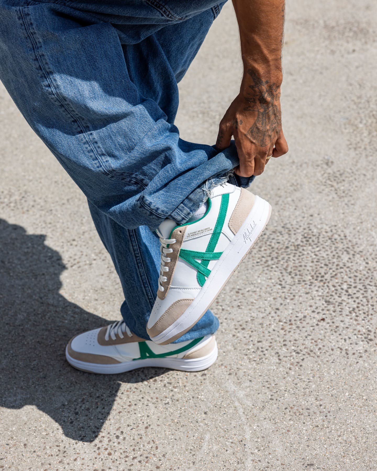 Close-up of a green and beige sneaker
